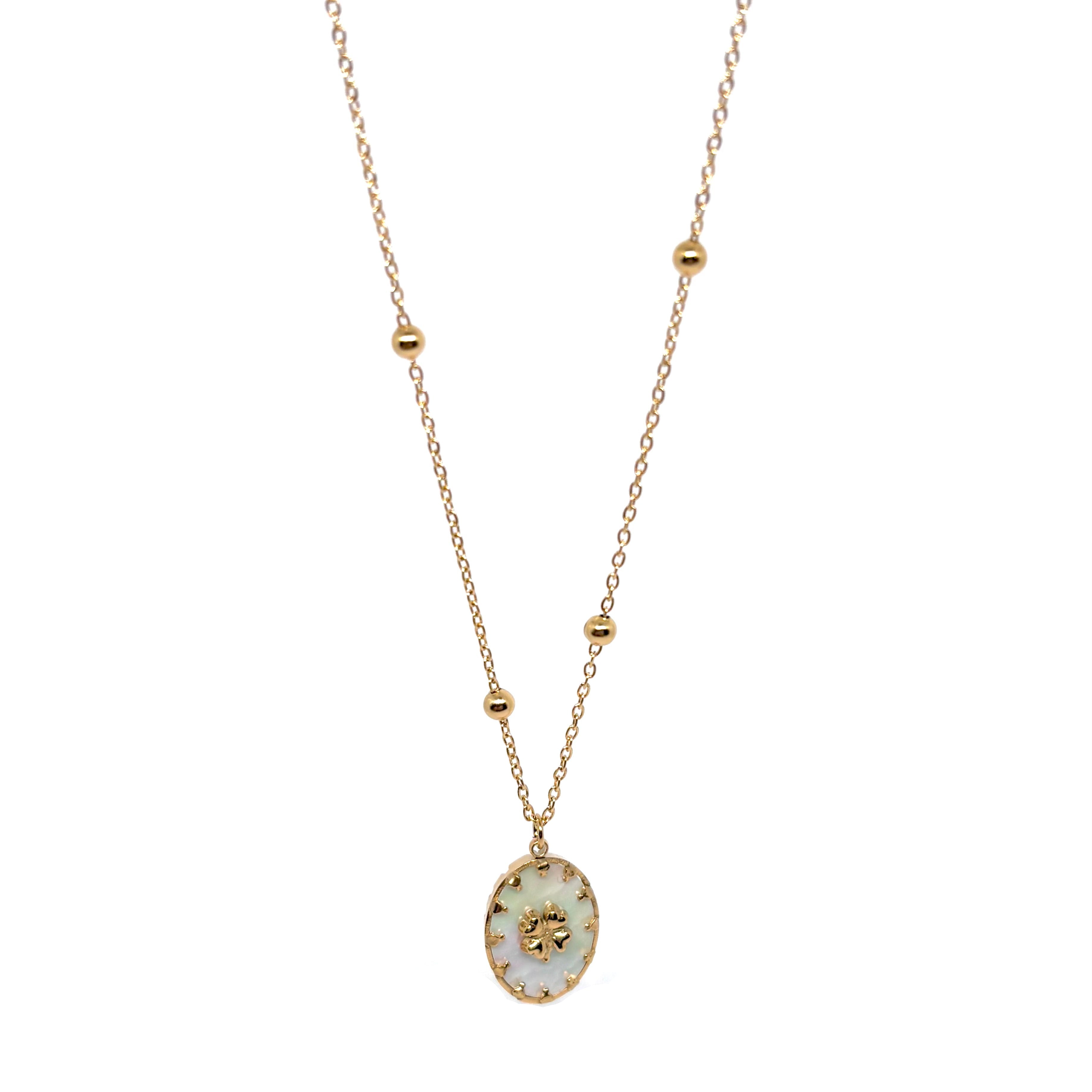 Collier double chaîne pour femme en acier inoxydable couleur doré, orné d’un médaillon en nacre naturelle avec étoile dorée à huit branches. Bijou lumineux et raffiné, résistant à l’eau et hypoallergénique, au style céleste et élégant